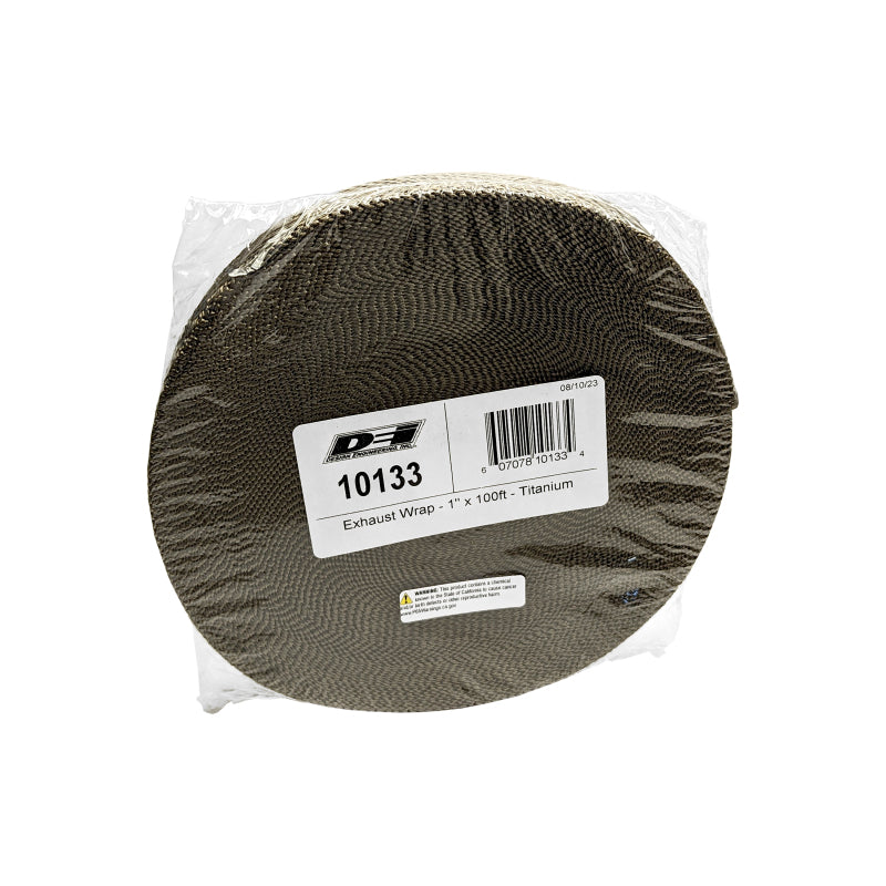 DEI Titanium Exhaust Wrap, 1 inch x 100 feet, coiled around a car exhaust pipe for heat insulation and performance enhancement.