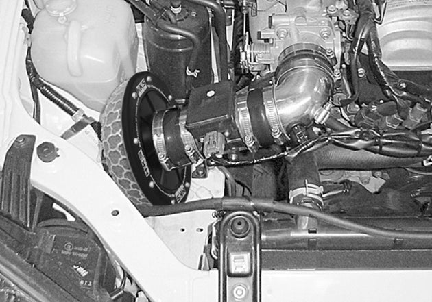 HKS SPF NB8C BP-ZE direct fit air filter installed in a vehicle engine bay, showcasing the high-performance air filter for Nissan models