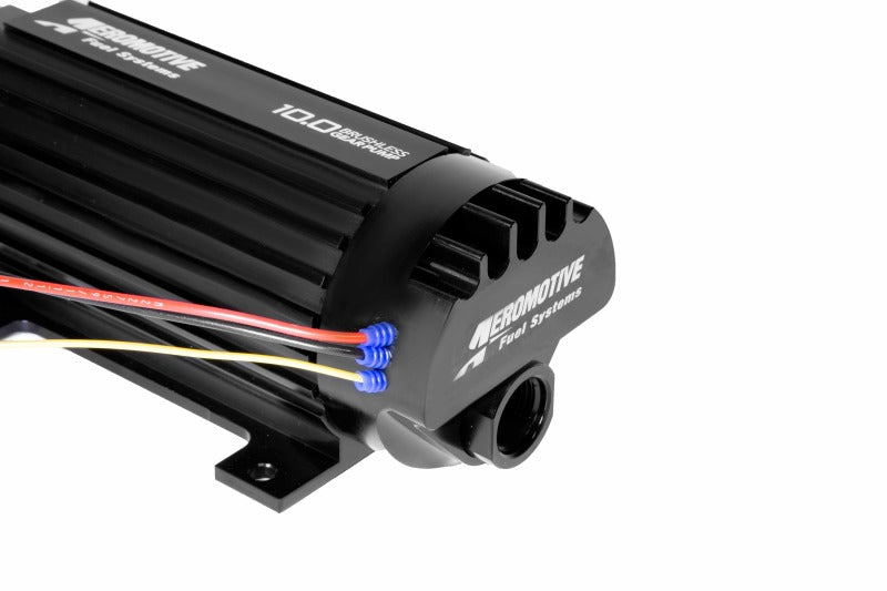 Aeromotive TVS In-Line Brushless Spur 10.0 external fuel pump with metallic body and inlet/outlet fittings.
