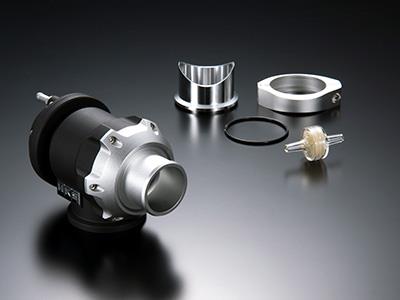 HKS racing SQV universal blow off valve with aluminum body and hose connections, designed for high-performance turbocharged vehicles.