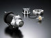 HKS racing SQV universal blow off valve with aluminum body and hose connections, designed for high-performance turbocharged vehicles.
