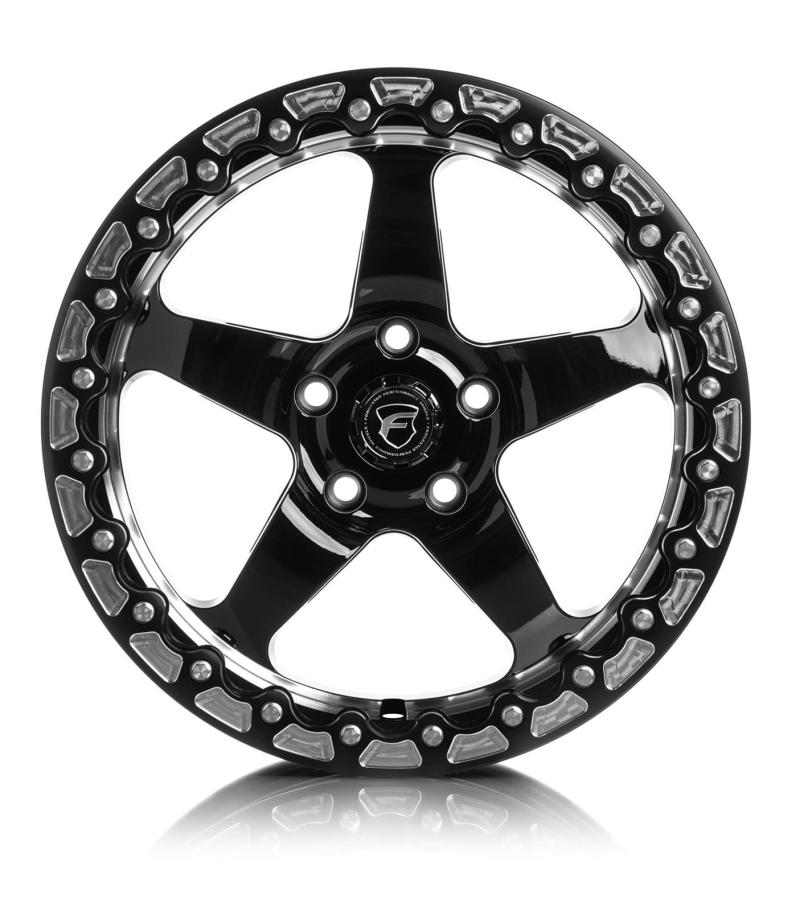 Forgestar D5 Beadlock 17x10 cast wheel in gloss black with 5x115 bolt pattern, ET00 offset, 5.5-inch backspacing, displayed on a vehicle.
