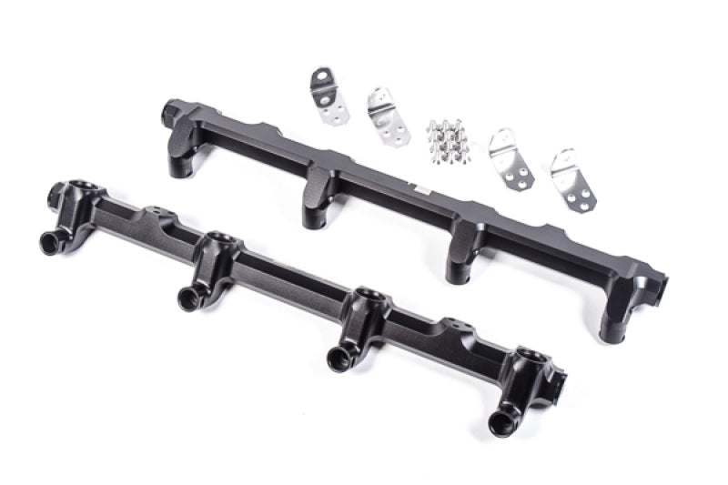 Radium Engineering GM LS9/LSA engine fuel rails installed on a high-performance LS engine, showcasing sleek metal design and fittings.