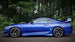 HKS Hipermax S coilover kit installed on a Toyota Supra JZA80, showing the adjustable shock absorbers and suspension components.
