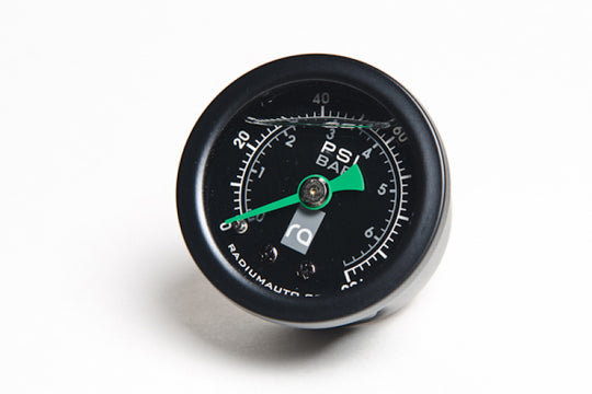 Radium Engineering 0-100 PSI fuel pressure gauge showing a clear dial and needle indicating pressure levels in a vehicle engine system.