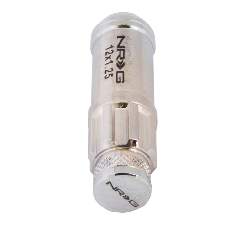NRG 700 Series M12 x 1.25 steel lug nut set with dust cap covers, locks, and lock socket in silver, shown in the image.