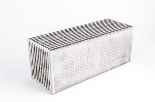 Garrett H2O / Air CAC intercooler for 1000 HP, compact cooling component with aluminum fins and inlet/outlet ports.