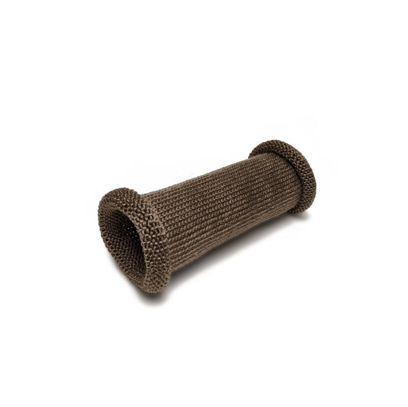 DEI Titanium 4-inch knit exhaust sleeve wrapped around a car exhaust pipe, showing the heat-resistant, metallic finish and stitching.
