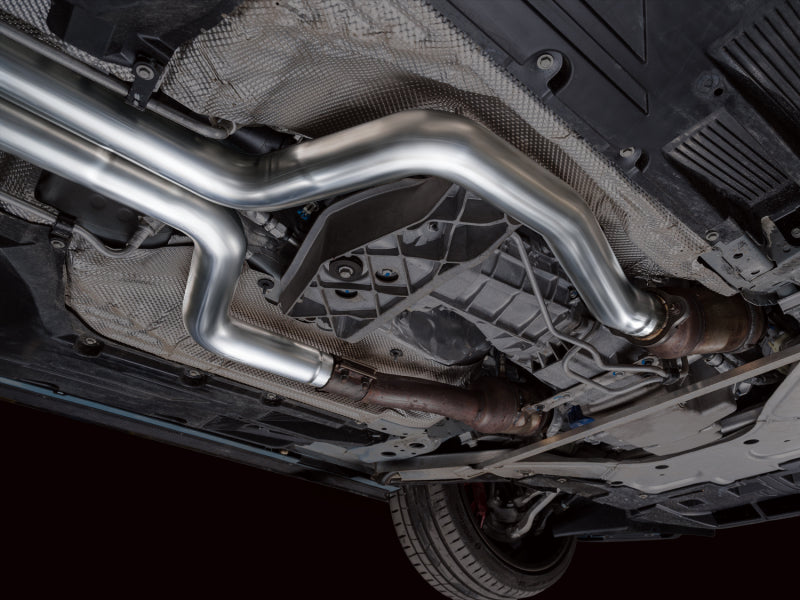 AWE Tuning Cadillac CT5-V Blackwing catback exhaust with chrome silver tips, showcasing sleek black finish and dual exhaust outlets.