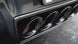 Corsa Performance axle back exhaust for Chevrolet Corvette C7 2014-2019 with dual NPP valves and quad black tips, showing the exhaust tips.