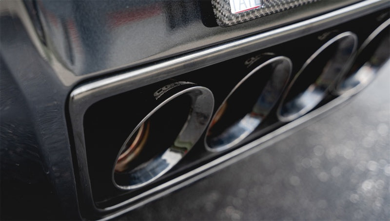 Corsa Performance axle back exhaust for Chevrolet Corvette C7 2014-2019 with dual NPP valves and quad black tips, showing the exhaust tips.